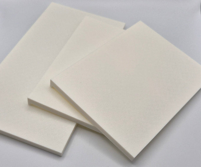 Three square off-white 3D-printed shelves stacked slightly offset on a white studio backdrop.