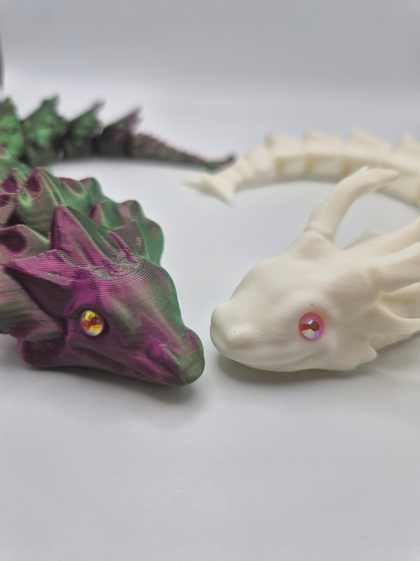 Two 3D printed articulated dragons