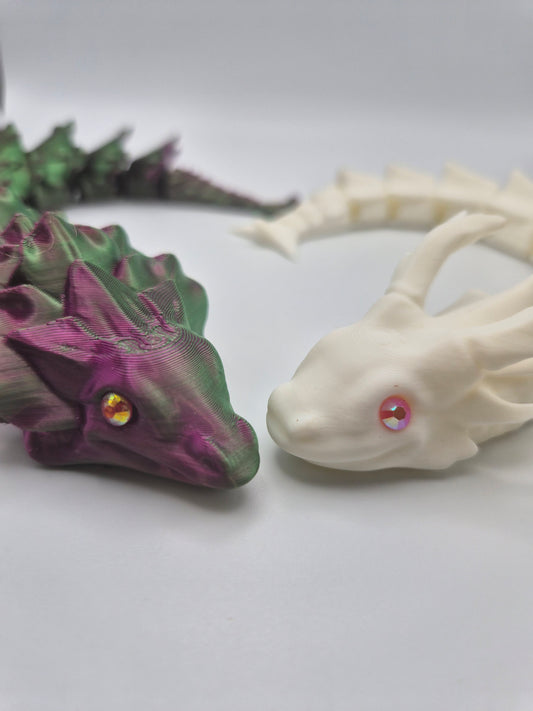 Two 3D printed articulated dragons