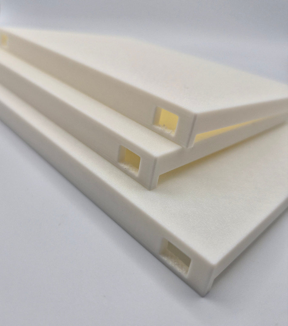 Three custom 3D printed shelves for a lizard habitat with square cutouts for attaching to the cage, stacked diagonally on a light gray background.