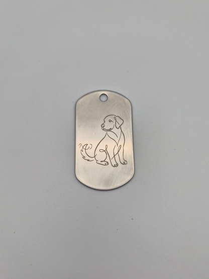 Aluminum military ID-style dog tag with an engraved dog design on a gray background
