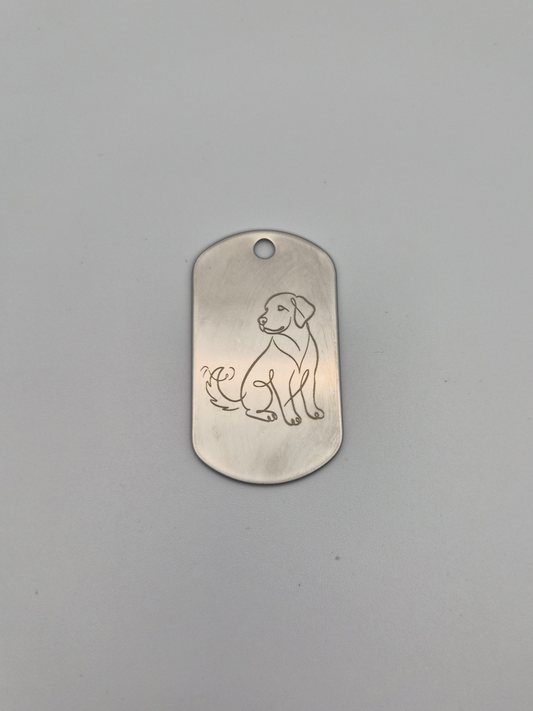 Aluminum military ID-style dog tag with an engraved dog design on a gray background